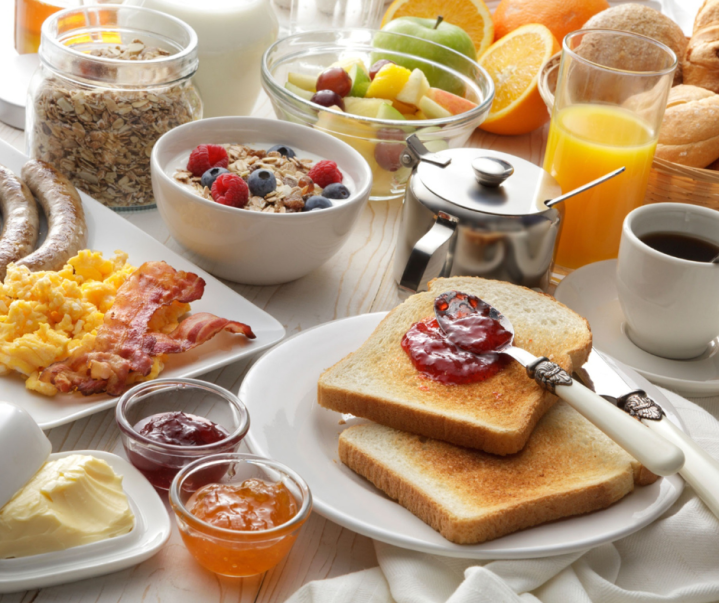 Image of fresh fruits, toast with jam and breakfast foods