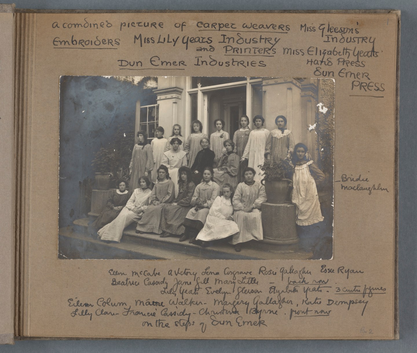 A black and white group photo of women carpet weavers