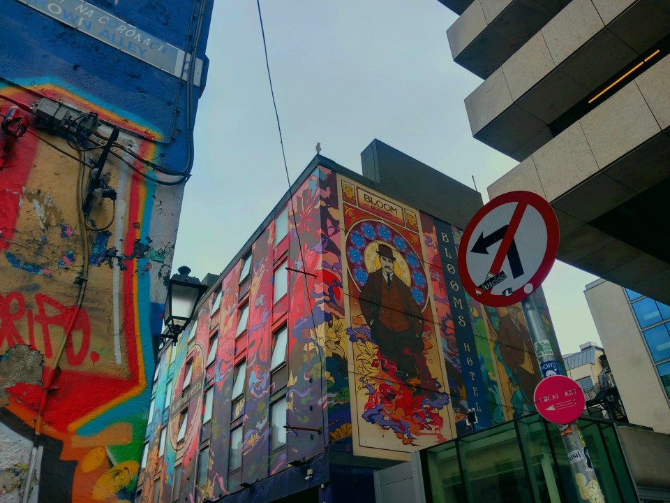 Colourful street art on the side of a hotel