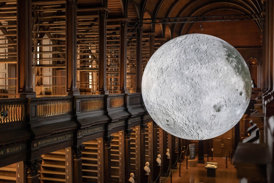 Luke Jerram's Museum of the Moon installation in the Long Room at Trinity College Dublin